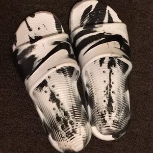 Black and white nike slides